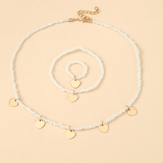 Children's Heart-Shaped Pearl Necklace Set with Matching Bracelet and Ring - Minimalist Princess Style Jewelry for Girls Aged 6 to 10 Years