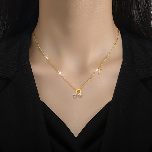 Collar con colgante de nota musical minimalista para hombres y mujeres en acero titanio con chapado en oro y motivo floral