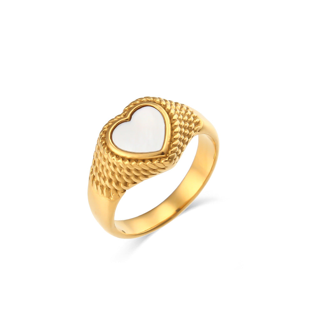 Anillo de acero inoxidable con forma de corazón estilo lujo, baño de oro de 18K y diseño trenzado.