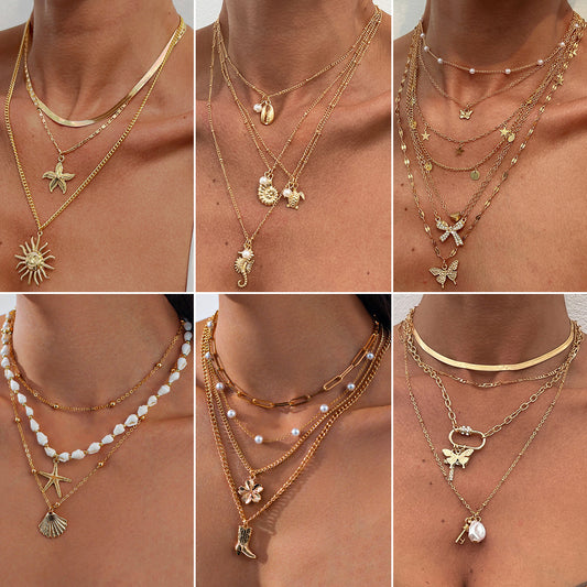 Collana con ciondolo a stella e fiore in stile vacanza per donna con perla finta, lega, finitura placcata, nappa e design geometrico su catena di perle