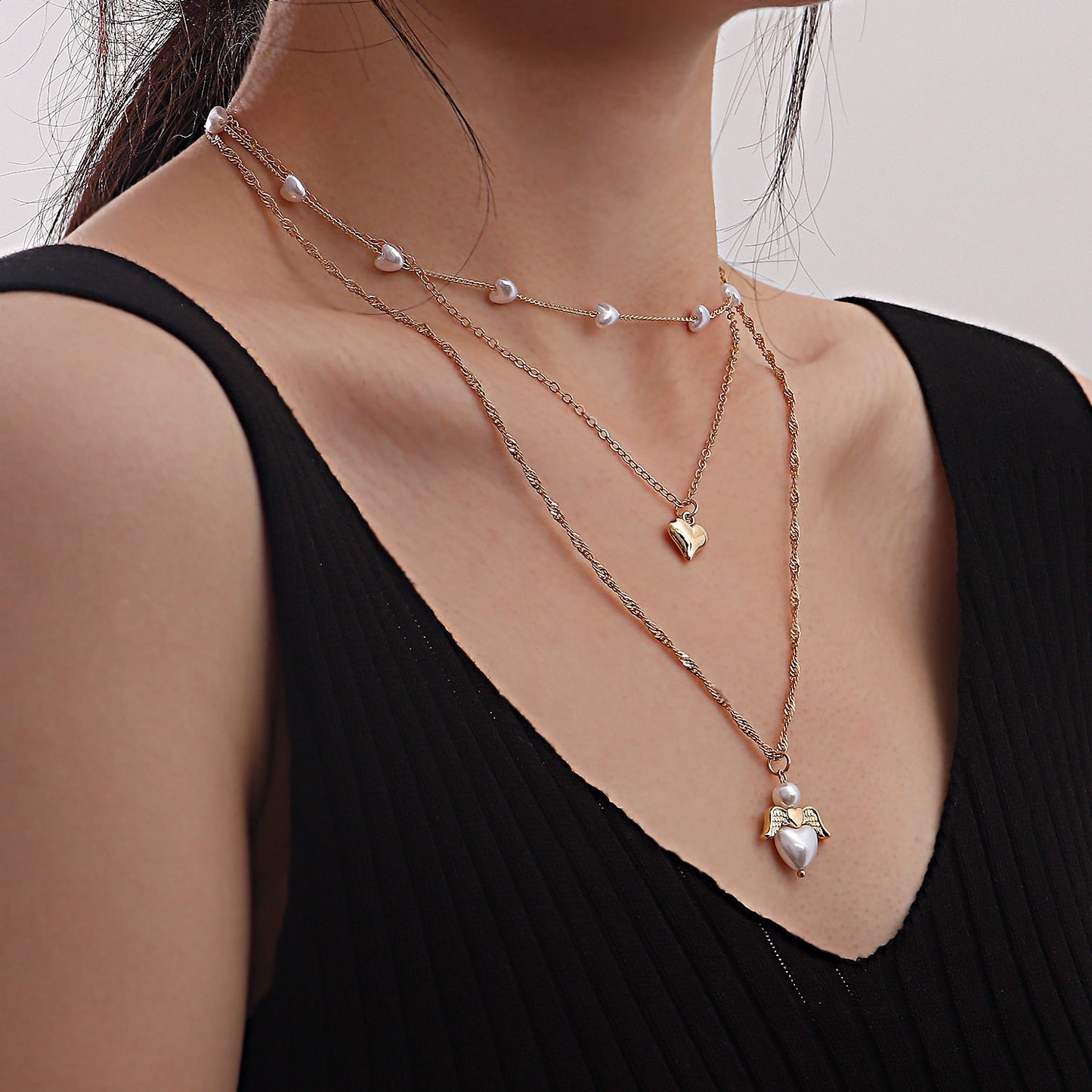 Minimalist Multi-Layer Heart-Shaped Pearl and Angel Wing Necklace for Women in Alloy with Plated Finish