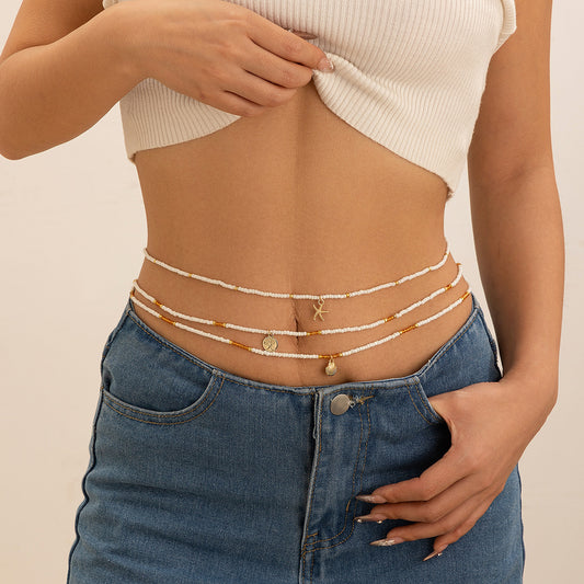 Catena da vita da donna in stile bohémien con conchiglie e nappine, con fascia elastica regolabile e chiusura a moschettone