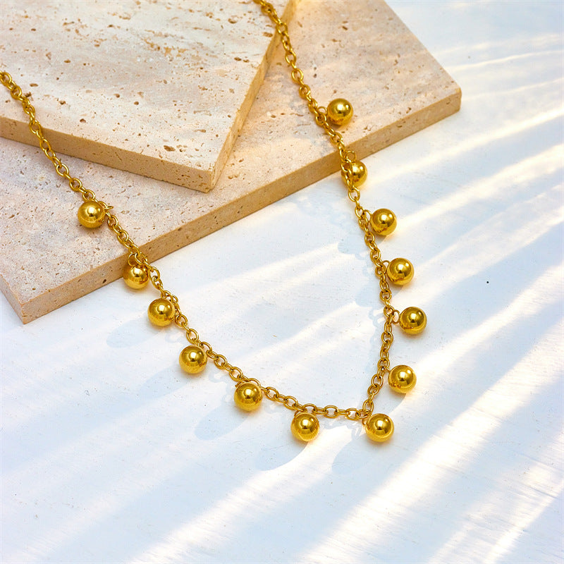 Collar de acero inoxidable chapado en oro con colgante de bola retro minimalista y diseño geométrico para mujer