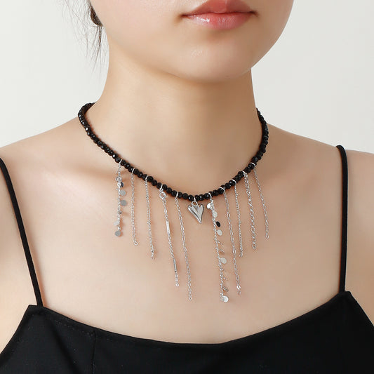 Collana alla moda da donna con nappe e perline di cristallo nero con ciondolo a cuore in lega placcata