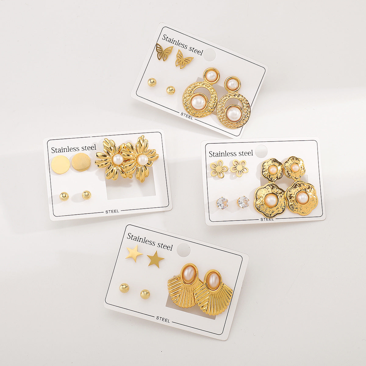 Aretes de Acero Inoxidable con Diseño Geométrico de Estrella Floral y Detalles de Perlas para Mujer