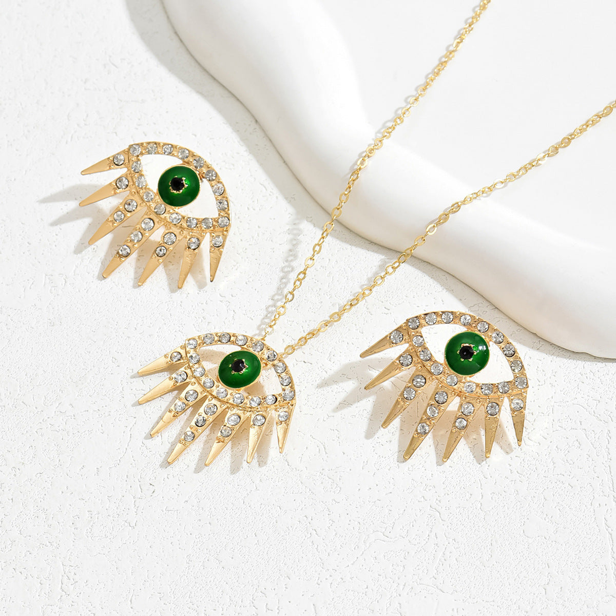 Conjunto de collar con colgante de ojo turco estilo Hip Hop y pendientes de tuerca de aleación con incrustaciones de diamantes de imitación para mujer
