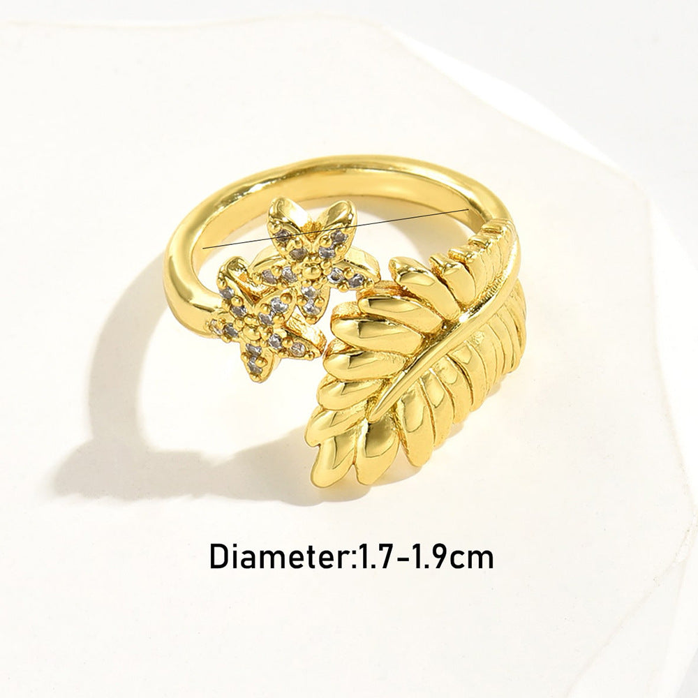 Anello da donna a forma di fiore a foglia geometrica in rame con placcatura in oro 18 carati e zirconi micro-pavé