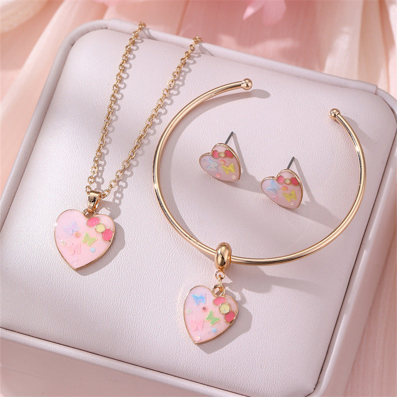 Juego de collar minimalista de aleación con forma de lazo con acabado esmaltado para niños, pulsera con colgante de nube y pendientes de tuerca