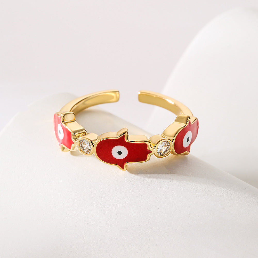 Anello da donna in rame con placca in oro 18K, finitura smaltata e intarsio in zircone, design Mano di Fatima