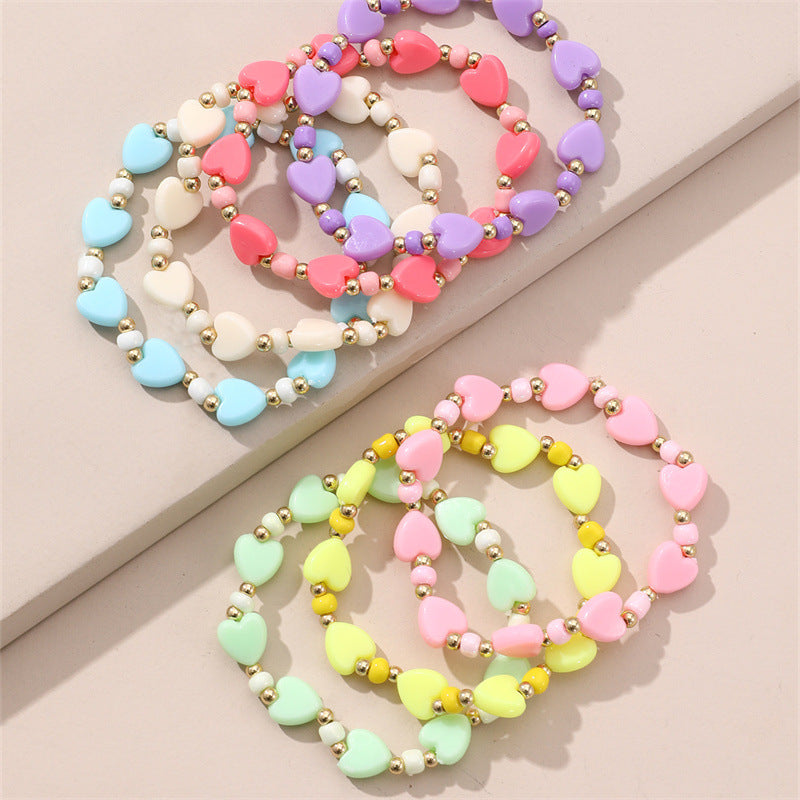 Braccialetto Minimalista a Stella con Perline per Bambini Realizzato in Plastica e Resina con Accenti Floreali Colorati