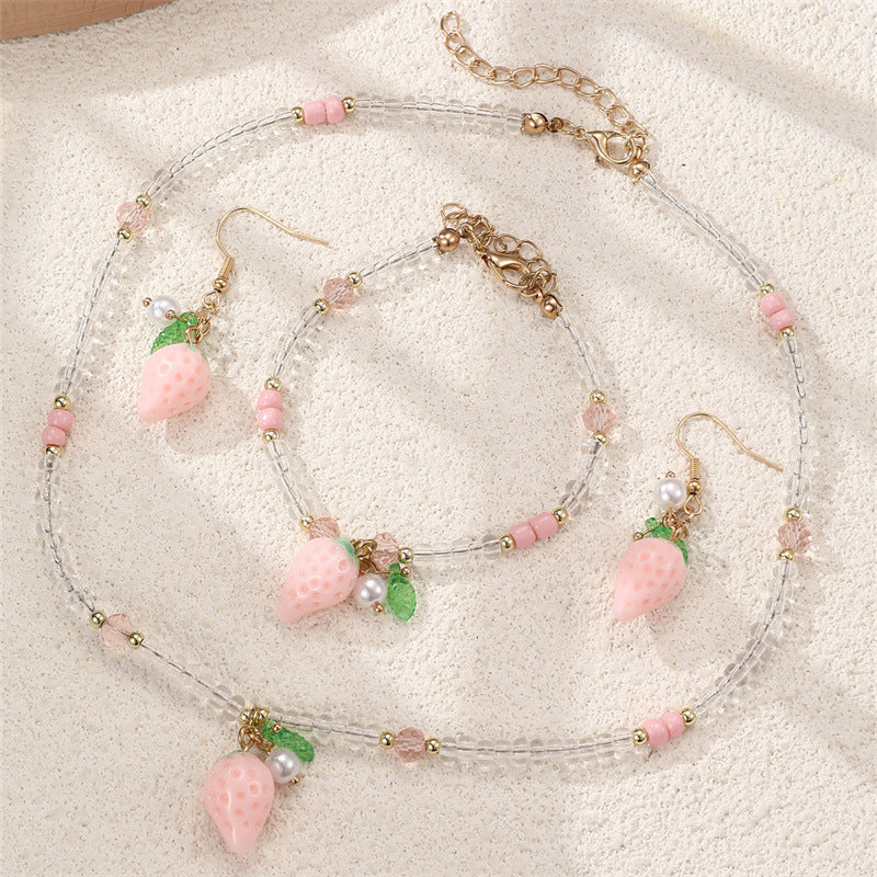 Set collana e braccialetto in lega con fiocco minimalista per ragazze con ciondoli a forma di ciliegia, uva, frutta e stella marina