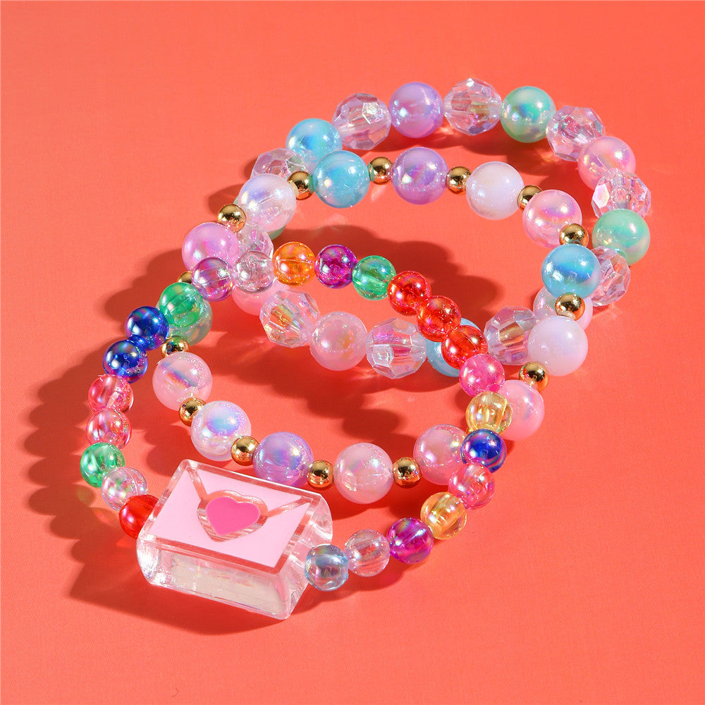 Juego de pulseras de resina con cuentas en forma de corazón estilo caricatura con dijes de cola de sirena y conchas marinas para niños