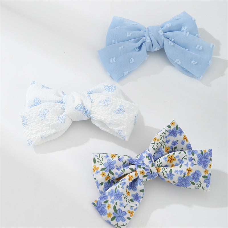 Set di fermagli per capelli minimalisti con fiocco a margherita per bambini in tessuto con palette di colori macaron e texture a maglia