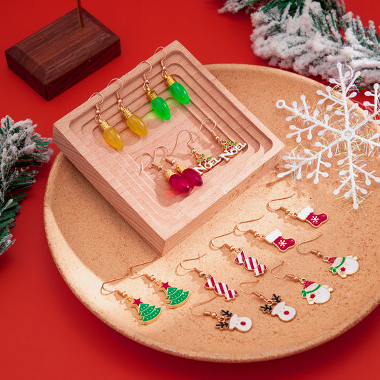 Pendientes de vacaciones minimalistas esmaltados de colores con forma de bombilla de muñeco de nieve y temática navideña festiva para mujer