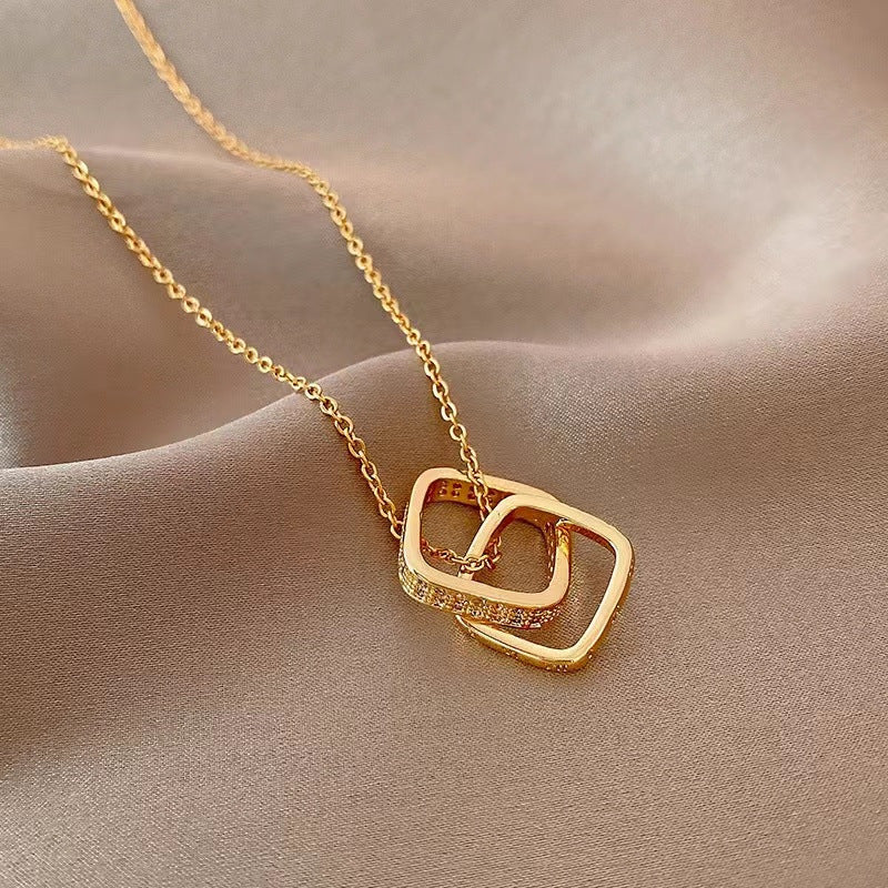 Minimalist Geometric Double Ring Pendant Necklace for Women in Titanium Steel with 18K Gold Plating and Micro-Pave Zirconia