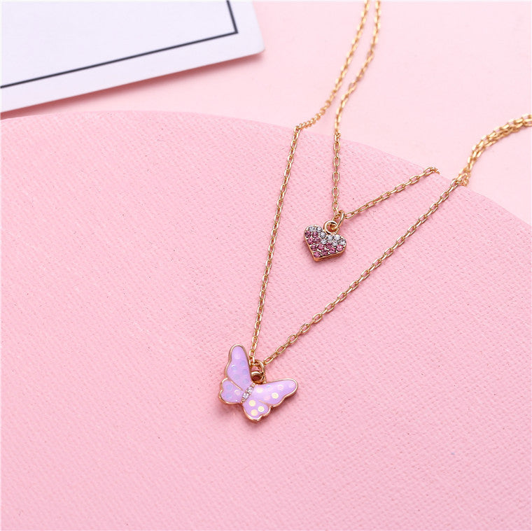 Collana con Ciondolo a Farfalla Minimalista Dolce per Ragazze in Lega Multistrato con Ciondolo a Cuore Smaltato Color Caramella e Catena a Croce