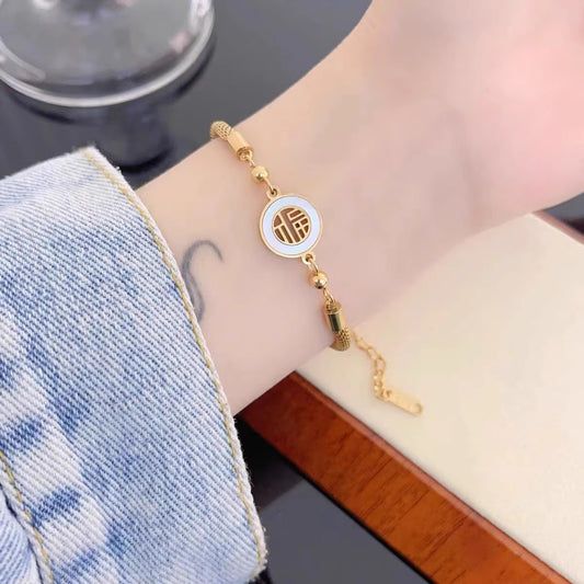 Pulsera de acero titanio chapado en oro de 18 quilates, diseño original con carácter chino de la fortuna para mujer, tejido