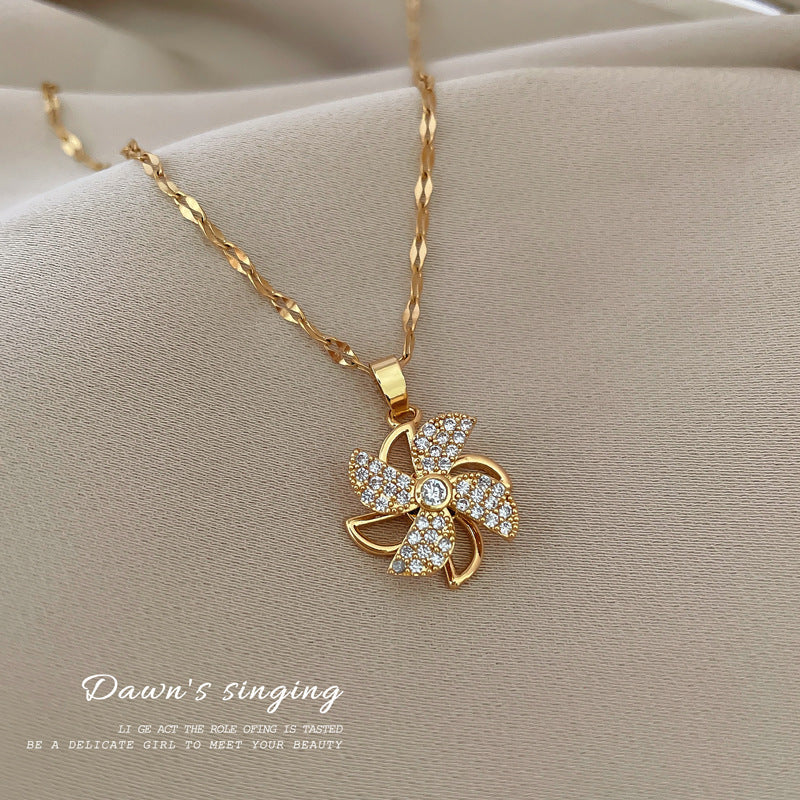 Collana con ciondolo a mulino a vento girevole da donna con design cavo e strass completi in acciaio al titanio, catena a medaglione in stile geometrico minimalista