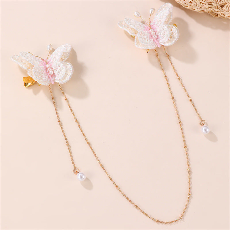Fermaglio per capelli con fiocco a farfalla in stile naturale per bambini, con materiale in resina e dettaglio catena con nappina