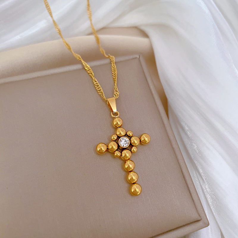 Collana Pendente a Croce con Catena a Sfera Minimalista in Acciaio al Titanio con Dettaglio Floreale Placcato Oro