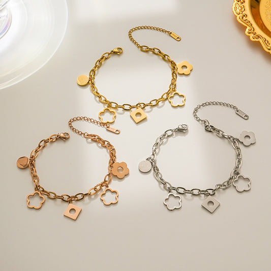 Bracciale da donna alla moda in acciaio al titanio a forma di rombo con ciondolo a fiore