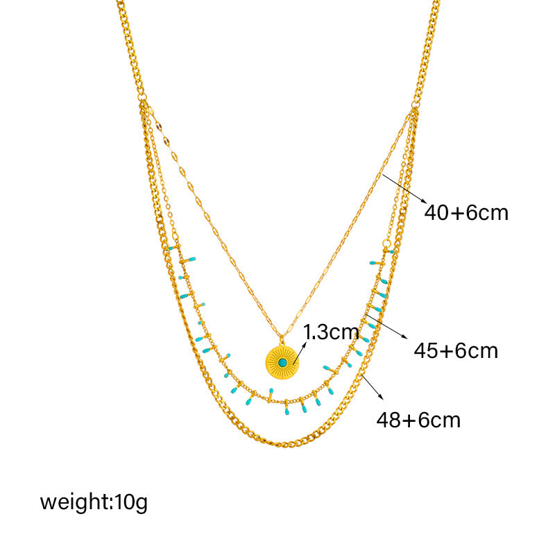 Collana da donna vintage in stile etnico con ciondolo rotondo turchese in acciaio al titanio con finitura placcata