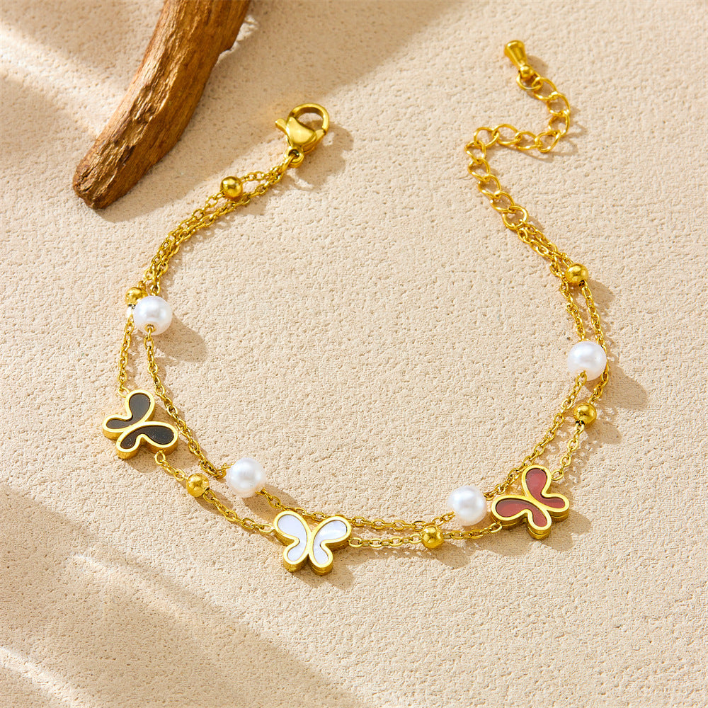 Bracciale minimalista da donna in acciaio inossidabile a forma di fiocco con placcatura in oro e inserti di perle