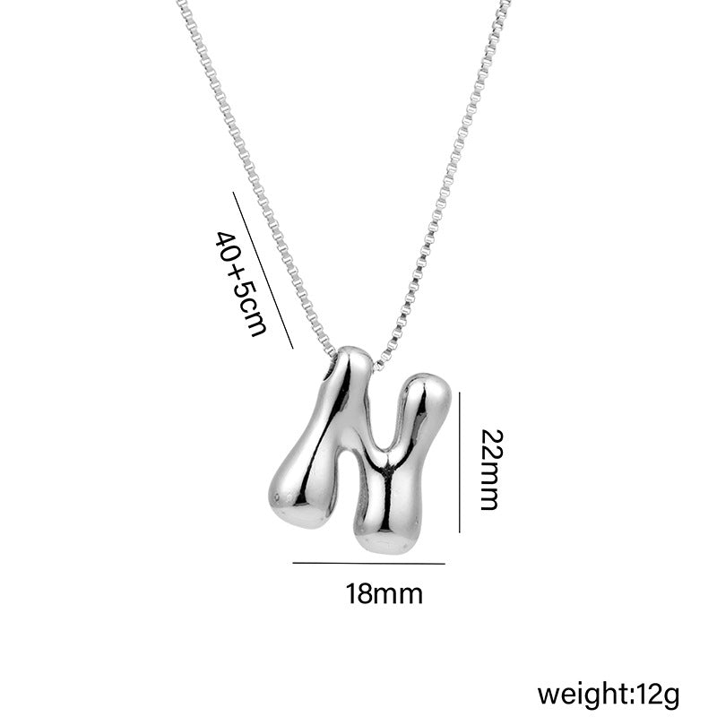 Collar con colgante de acero titanio con forma de letra minimalista y chapado en oro para mujer