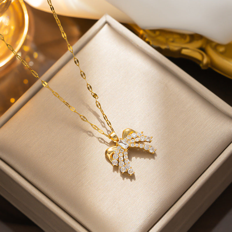 Collar minimalista con lazo para mujer, colgante de acero titanio con incrustaciones de diamantes de imitación y cadena ondulada
