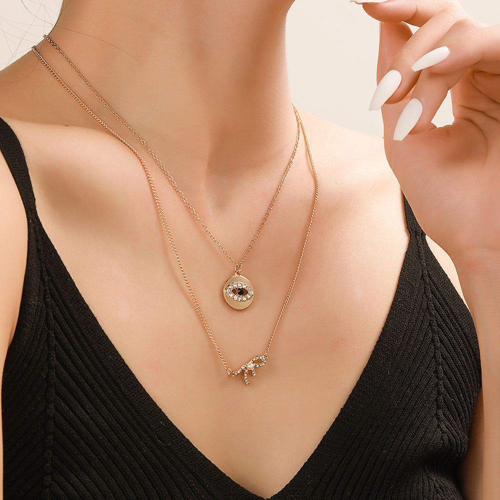 Sweet Rhinestone Inlaid Alloy Butterfly Evil Eye Bow Pendant Necklace with Curb Chain for Women