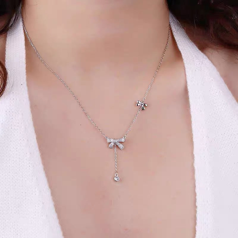 Sweet Bow-Shaped Titanium Steel Necklace with Rhinestone Inlay, Minimalist Cold-Tone Clavicle Chain for Women