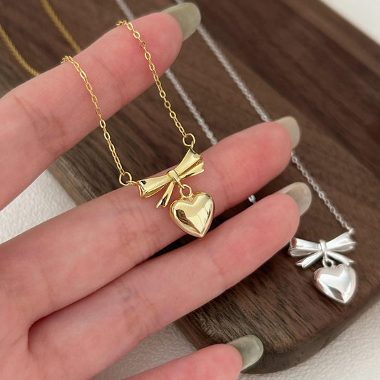 Minimalist Heart and Bow Pendant Necklace in 925 Sterling Silver with Gold Plating on Cross Chain