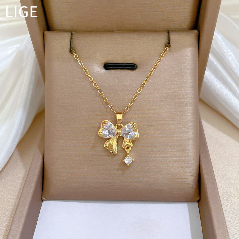 Collar de lujo de acero de titanio con colgante de mariposa y lazo de diamantes de imitación para mujer con cadena ajustable de 21 a 50 cm