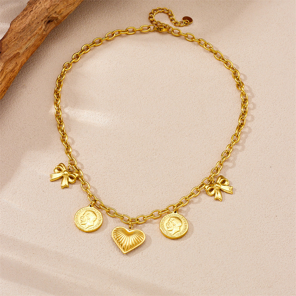 Vintage Style Heart and Bow Pendant Necklace in Stainless Steel with Gold Plating on O-Chain