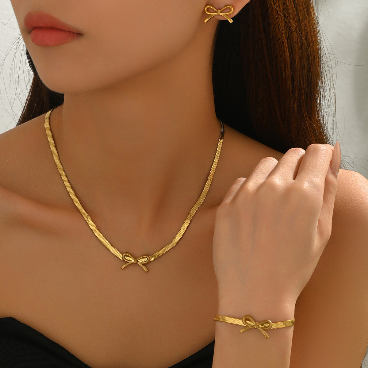 Juego de collar y aretes de diseño de lazo geométrico con baño de cobre para mujer