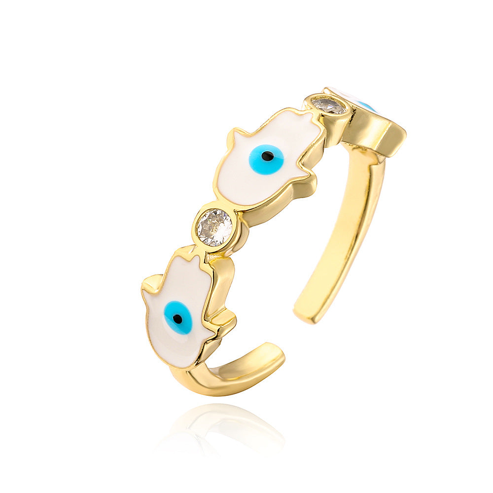 Anello da donna in rame con placca in oro 18K, finitura smaltata e intarsio in zircone, design Mano di Fatima