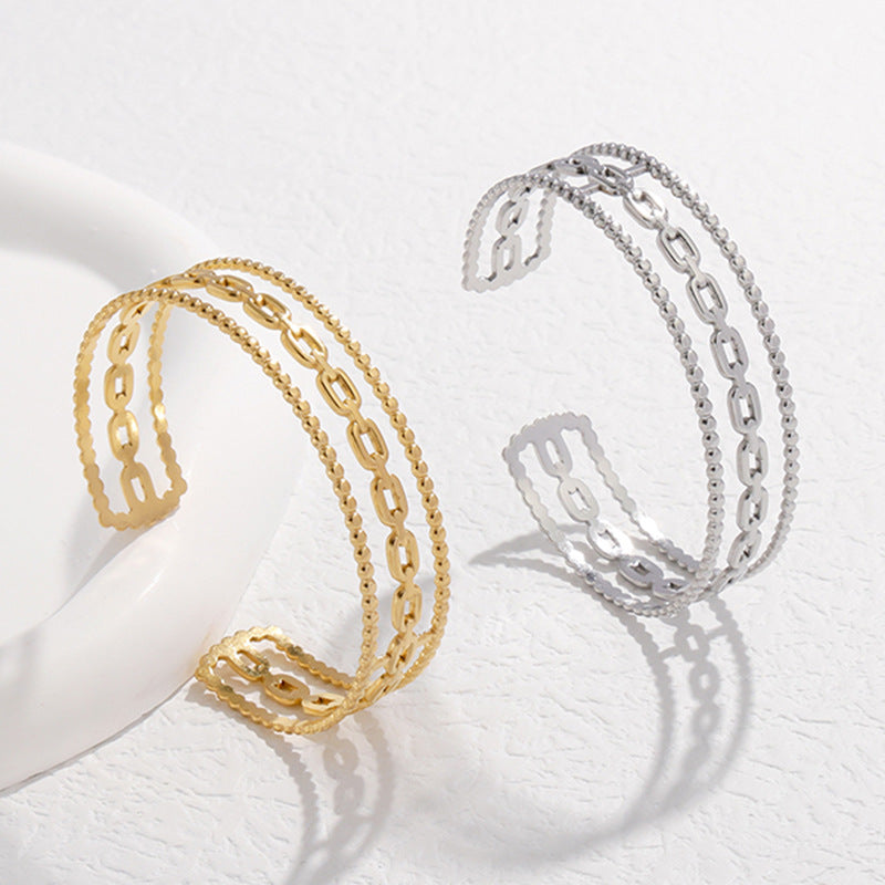 Bracciale da donna in acciaio al titanio con design geometrico minimalista, a forma di C, finitura placcata e dettaglio catena