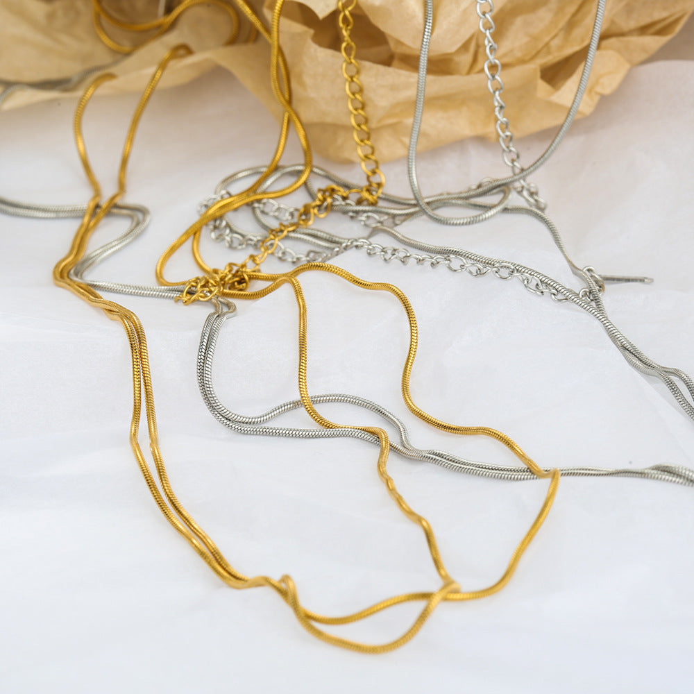 Cadena de cintura de doble capa de acero inoxidable con cadena de serpiente minimalista atrevida para mujer