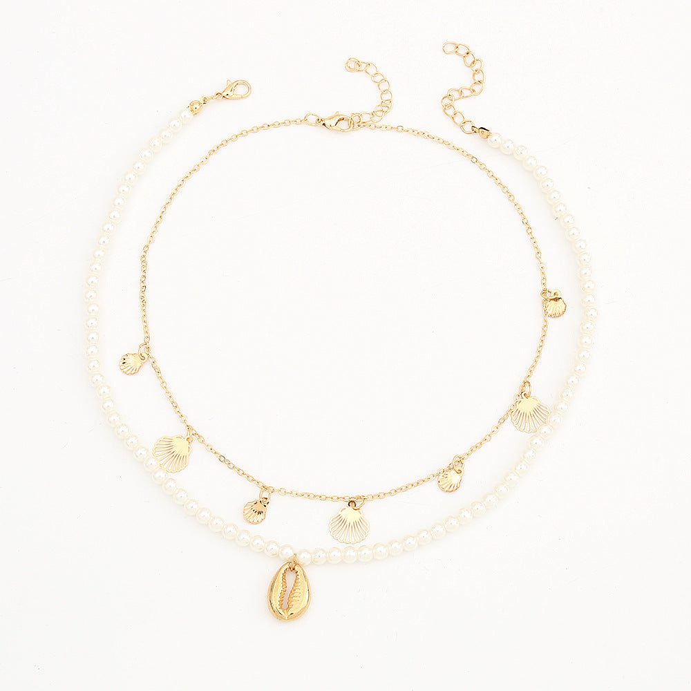 Set di collana con ciondolo a forma di conchiglia minimalista in lega per ragazze con catena di perle e finitura artigianale
