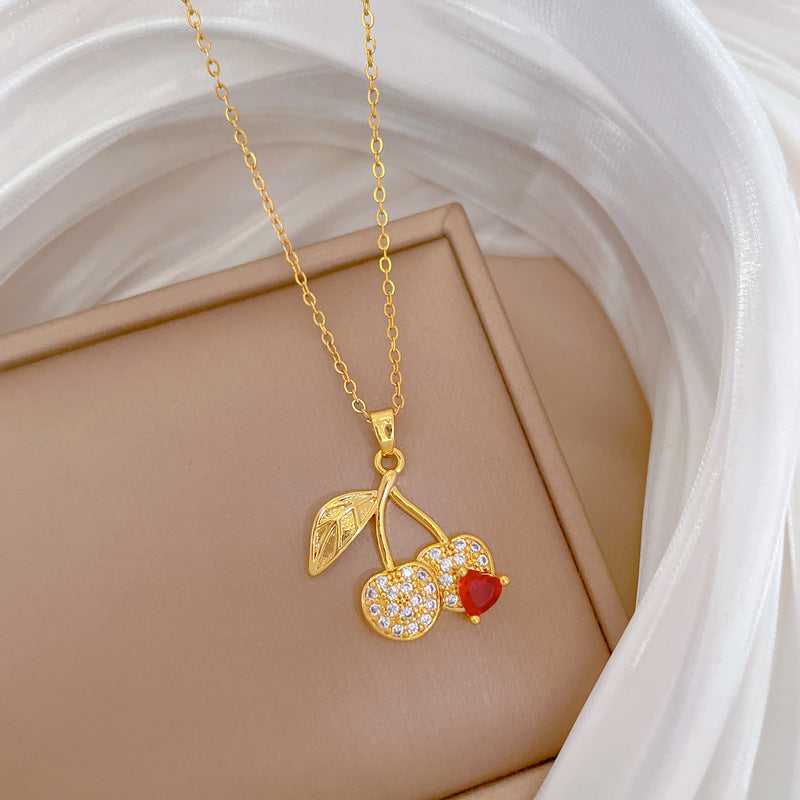 Collana con ciondolo a ciliegia stile cartone animato con strass per donna, catena in acciaio al titanio, design geometrico, stile minimalista a medaglione
