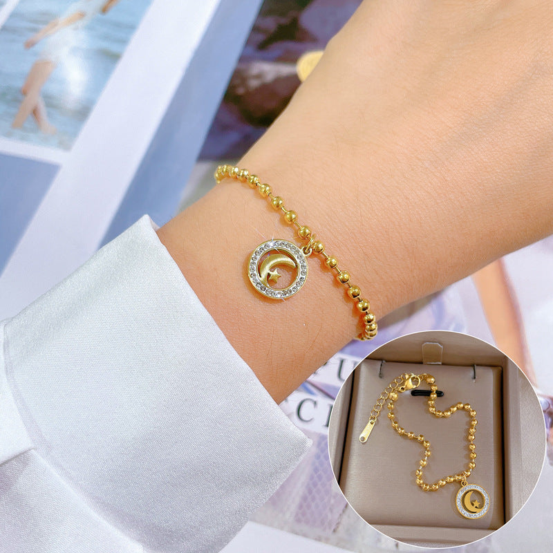 Bracciale Pendente Vintage Stella e Luna da Donna in Acciaio al Titanio Placcato Oro con Perline