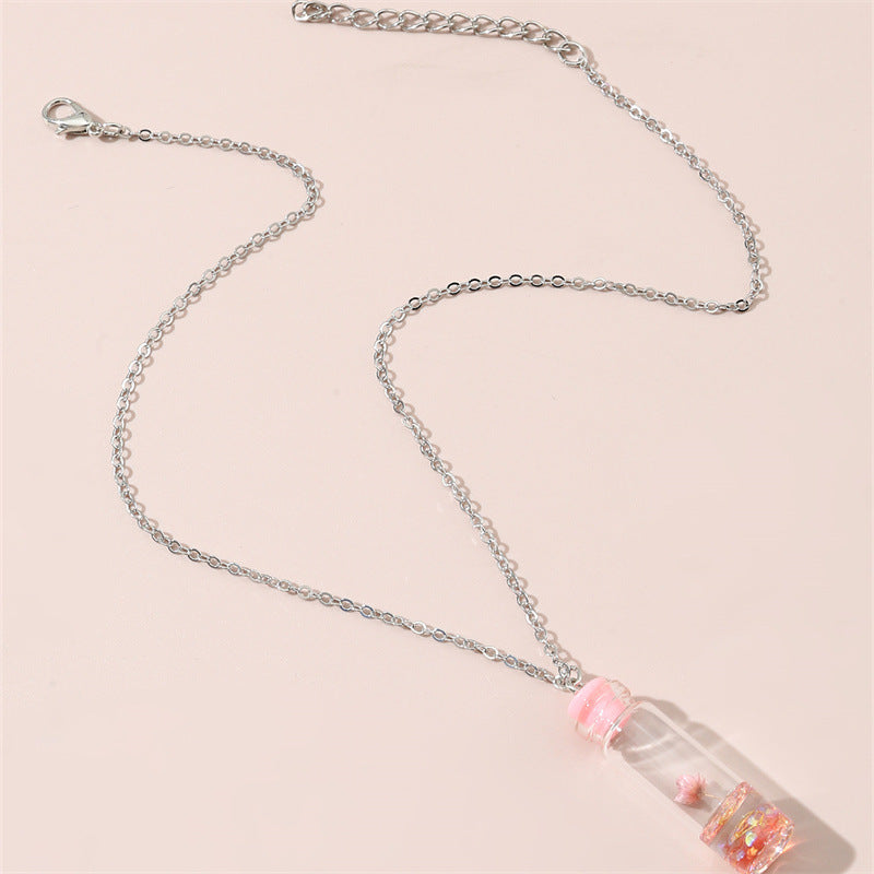 Collar con colgante de cristal geométrico minimalista para niños con flores secas rosas y encapsulación de resina