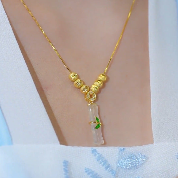 Collar minimalista de acero de titanio con forma de nudo de bambú para mujer con baño de oro y colgante floral irregular