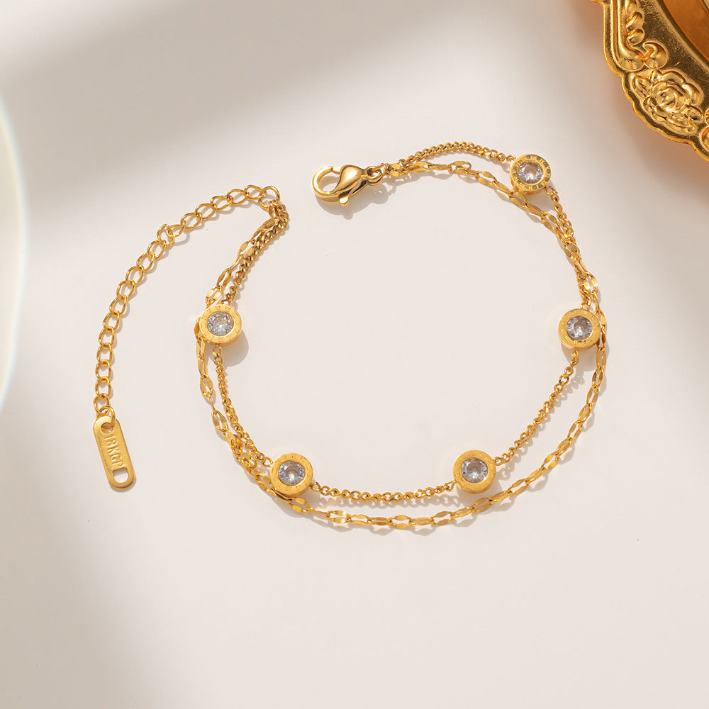 Bracciale minimale geometrico in acciaio al titanio con placcatura in oro rosa e singolo strass per donna