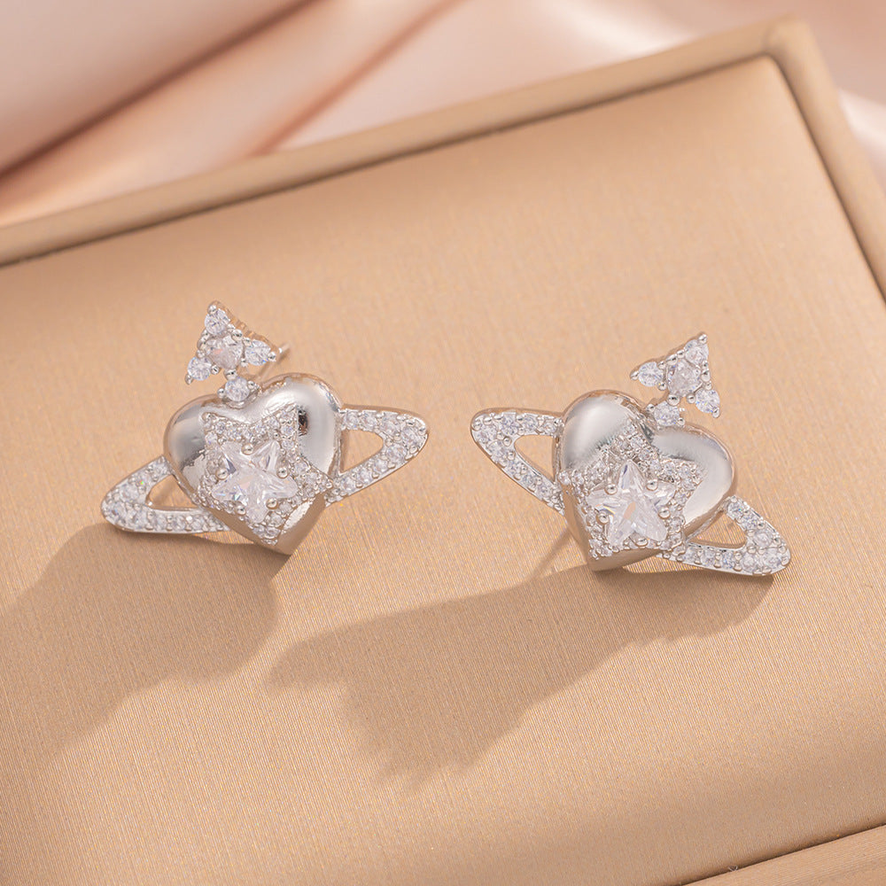 Orecchini a perno Saturno minimalisti color oro in ottone con zirconi per donna