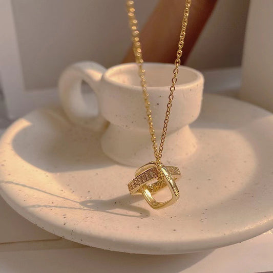 Minimalist Geometric Double Ring Pendant Necklace for Women in Titanium Steel with 18K Gold Plating and Micro-Pave Zirconia