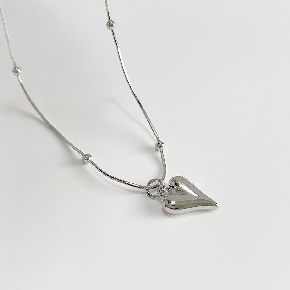 Collana da donna minimalista con ciondolo geometrico a cuore tondo in argento sterling 925