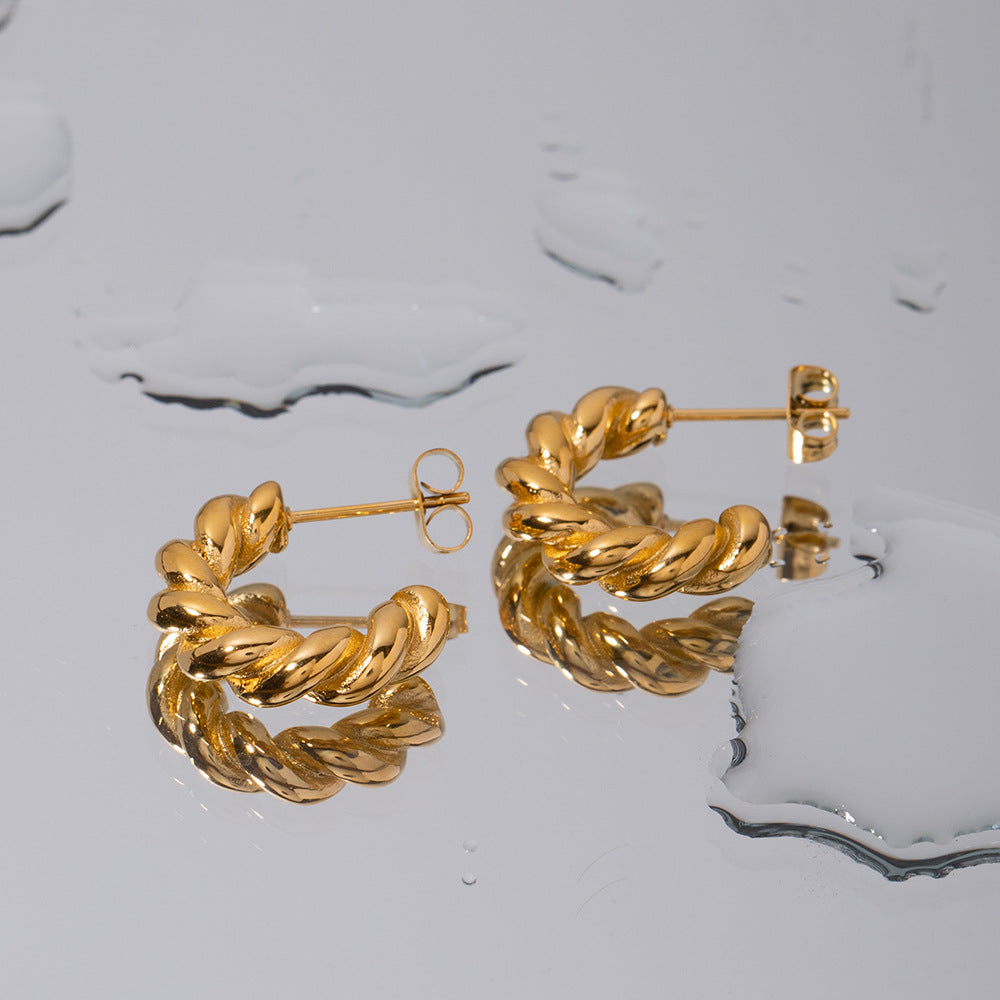 Orecchini a cerchio a spirale geometrica attorcigliata da donna in acciaio inossidabile con placcatura in oro 18 carati