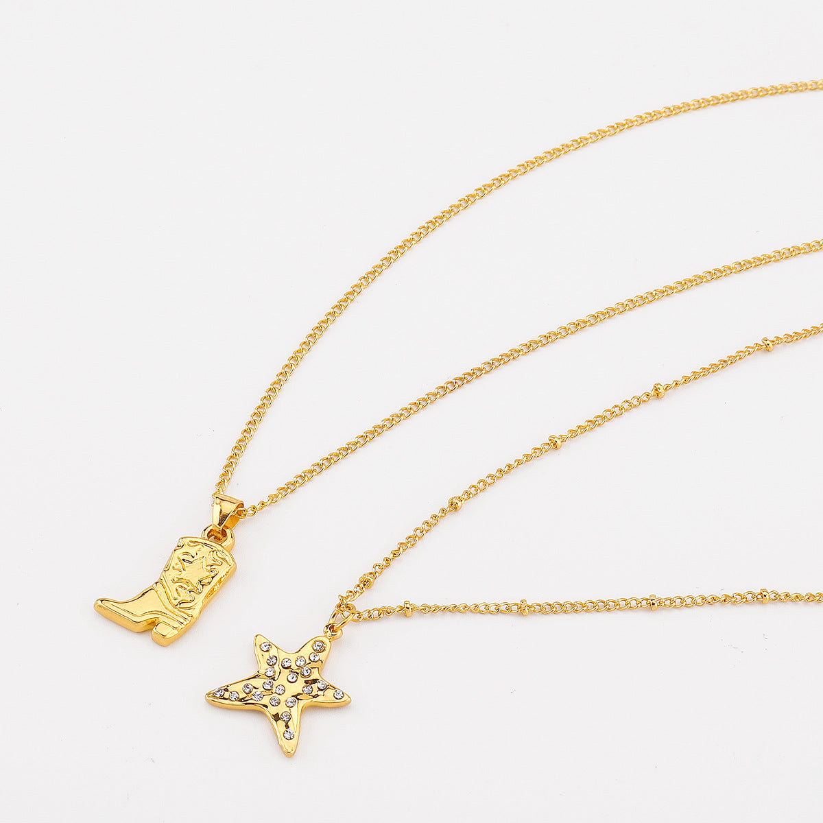 Collana alla moda con pendente a forma di stella, intarsi in strass e catena in ferro elettrodeposto, da donna