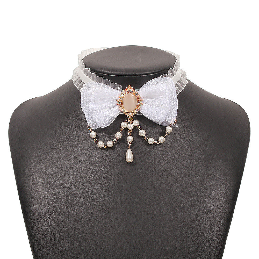 Collar de nudo de lazo geométrico dulce y atrevido con base de aleación, colgante de imitación de perla y detalles de estrella-luna para mujer